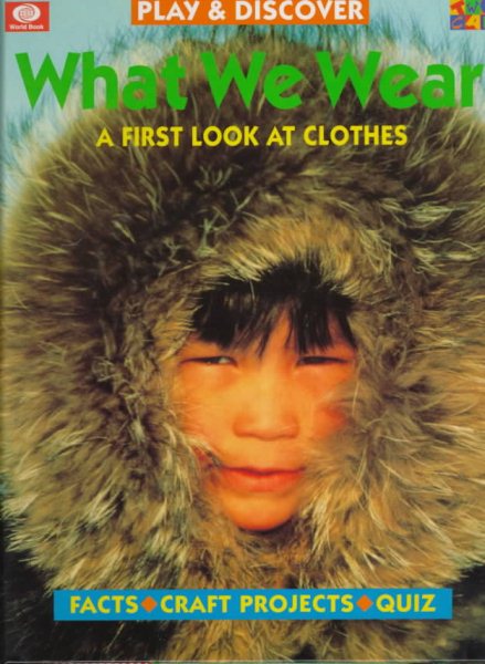 What We Wear: A First Look at Clothes (Play and Discover Series.) cover