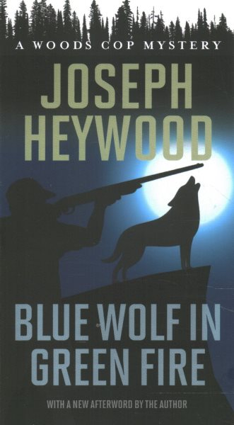 Blue Wolf in Green Fire: A Woods Cop Mystery (Woods Cop Mysteries) cover